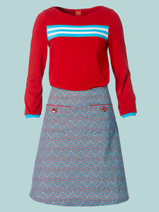Skjørt til dame a-fasong med grafisk print i rødt og turkis hos fashionintheforest nettbutikk